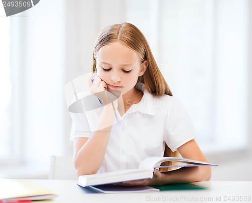 Image of student girl studying at school