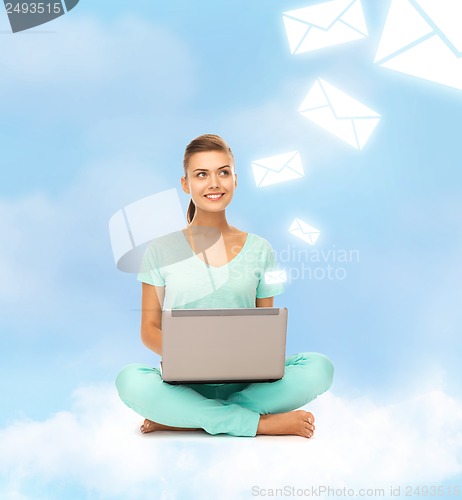 Image of woman sitting on the cloud with laptop