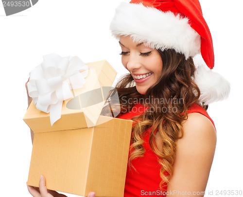 Image of smiling woman in santa helper hat with gift box