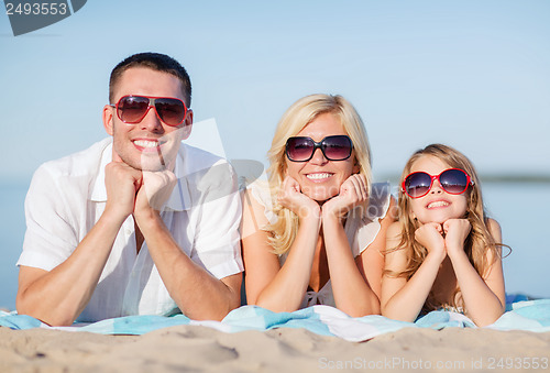 Image of happy family on the beach