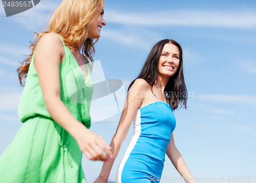 Image of girls walking on the beach