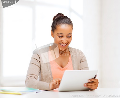 Image of smiling student girl with tablet pc