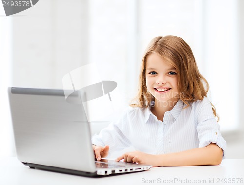 Image of girl with laptop pc at school