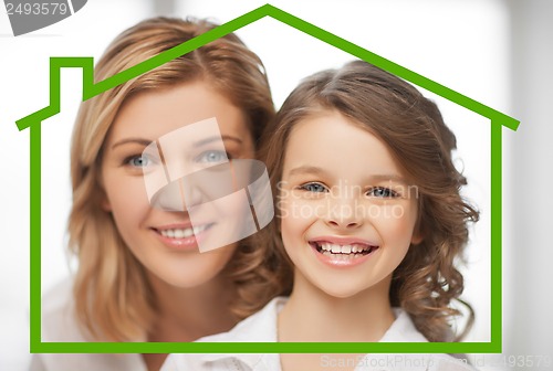 Image of mother and daughter with eco house
