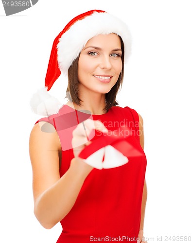 Image of woman in santa helper hat with jingle bells