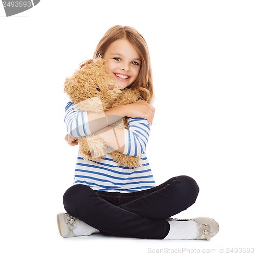 Image of cute little girl hugging teddy bear