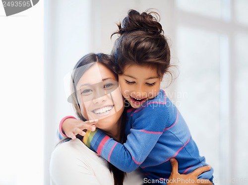 Image of hugging mother and daughter