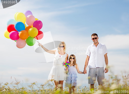 Image of family with colorful balloons