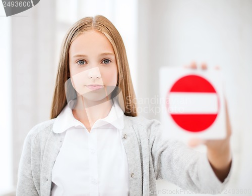 Image of girl showing no entry sign