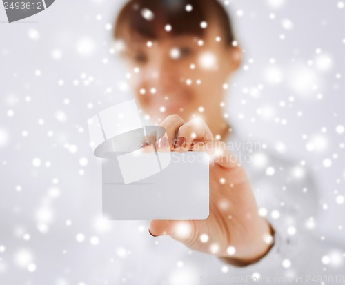 Image of businesswoman showing blank card