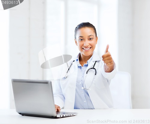 Image of female doctor with laptop pc