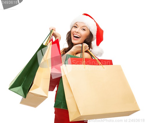 Image of woman in red dress with shopping bags