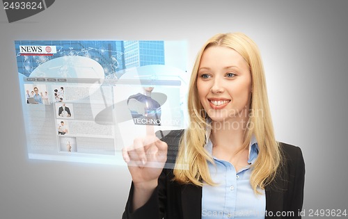 Image of businesswoman pressing buttons on virtual screen