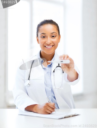 Image of doctor with thermometer and stethoscope