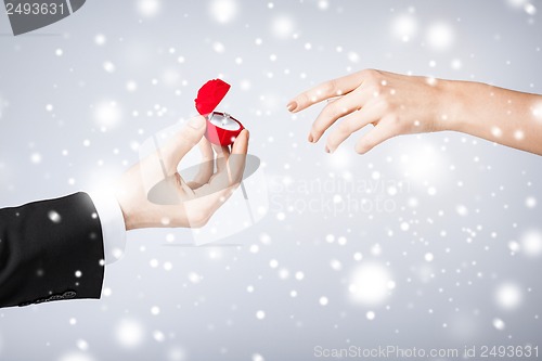 Image of couple with wedding ring and gift box