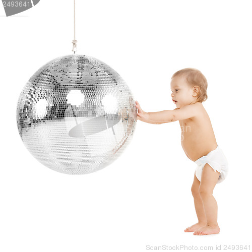 Image of toddler playing with disco ball