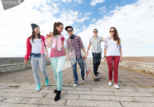 Image of teenagers with skates outside