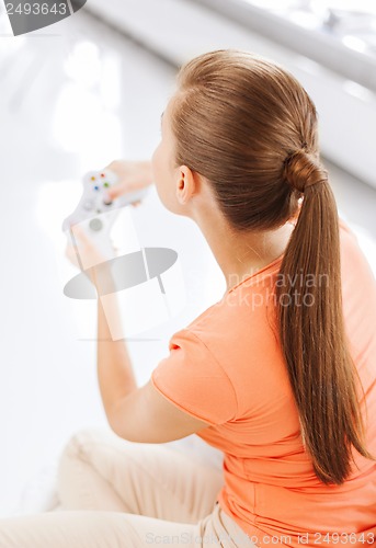 Image of woman with joystick playing video games