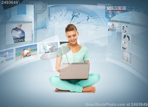Image of woman with laptop pc and virtual screens