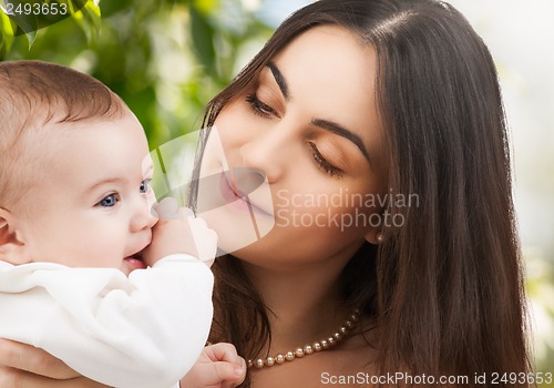 Image of happy mother with adorable baby