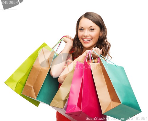 Image of woman in red dress with shopping bags