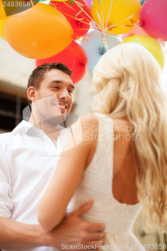 Image of couple with colorful balloons