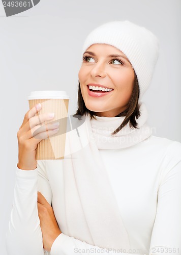 Image of woman in hat with takeaway tea or coffee cup