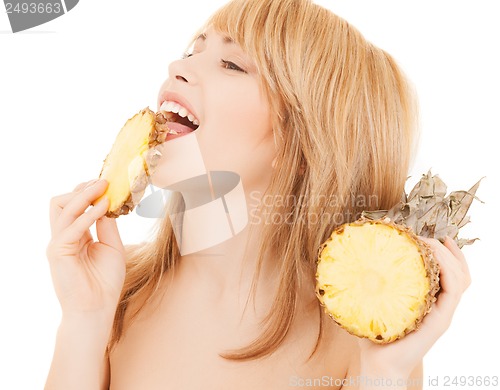 Image of happy girl with pineapple