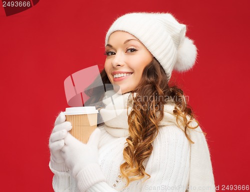 Image of woman in hat with takeaway tea or coffee cup