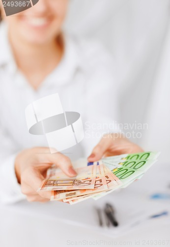 Image of woman hands with euro cash money