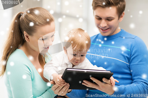 Image of parents and adorable baby with tablet pc