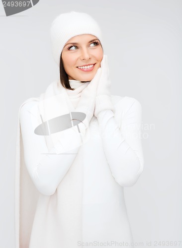 Image of woman in hat, muffler and gloves