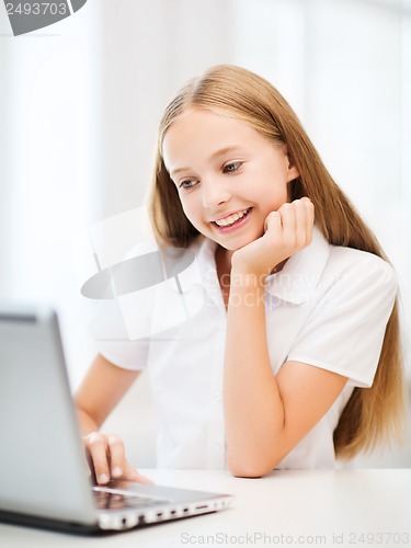 Image of girl with laptop pc at school