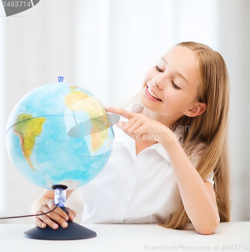 Image of student girl with globe at school