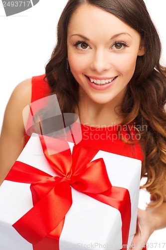 Image of smiling woman in red dress with gift box