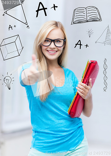Image of smiling student with folders
