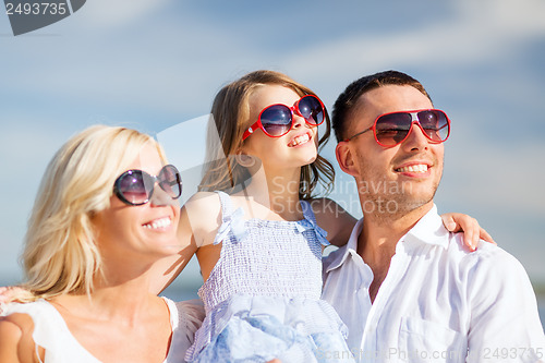 Image of happy family with blue sky