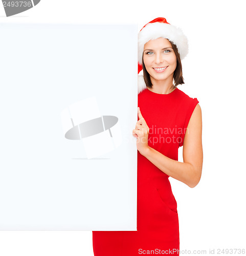 Image of woman in santa helper hat with blank white board