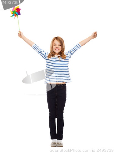 Image of child with colorful windmill toy