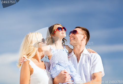 Image of happy family with blue sky
