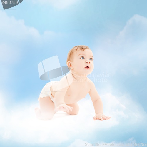 Image of smiling baby sitting on the cloud