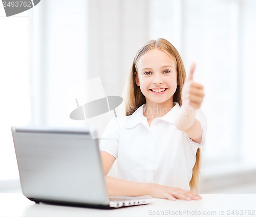 Image of girl with laptop pc at school