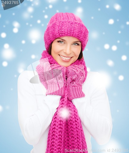 Image of woman in hat, muffler and mittens