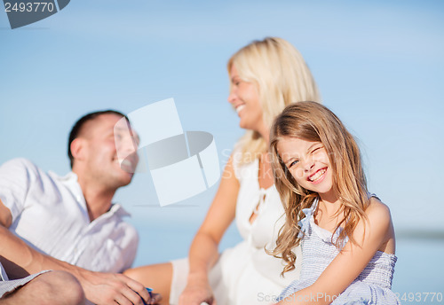 Image of happy family having a picnic