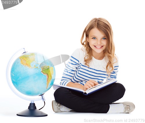 Image of girl with globe and book