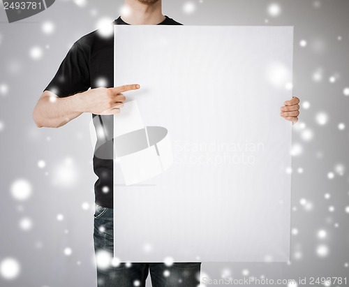 Image of man with blank white board