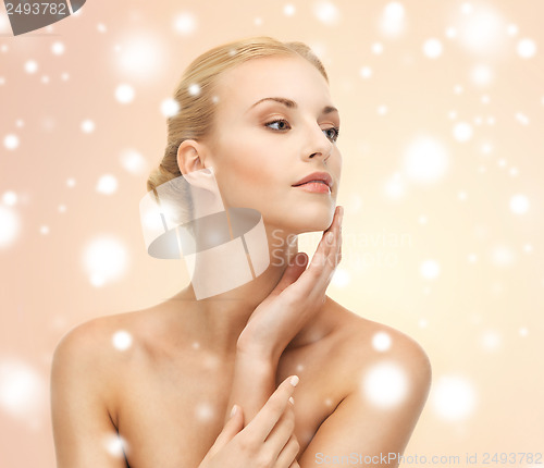 Image of face, hands and shoulders of beautiful woman