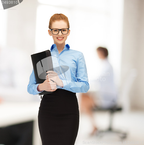 Image of smiling woman with folder