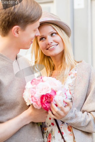 Image of couple with flowers in the city