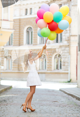 Image of woman with colorful balloons